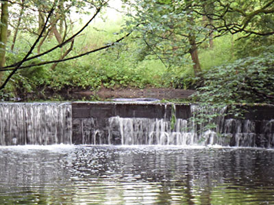 a waterfall over a stream